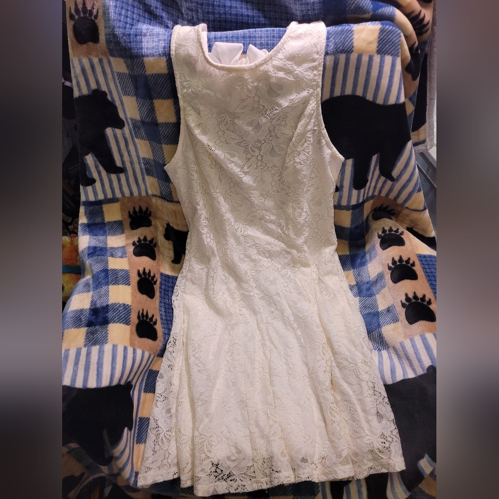 Speechless white lace dress with bow in back and pockets. Size L